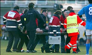 Wales and Llanelli winger Mark Jones is stretchered off the pitch