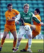 Garry O'Connor holds off two defenders