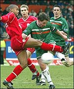 Billy Dodds fires in a rare shot