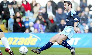 Burnley's Alan Moore puts his side ahead at Loftus Road