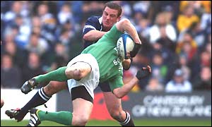 Brendan Laney makes a high tackle on Ireland's Brian O'Driscoll
