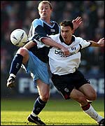 Tony Grant (left) gets to grips with Steed Malbranque