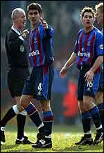 CrystalPalace's Danny Butterfield (4) and Tommy Black (16) argue with referee Dermot Gallagher after the ball appeared to go over the line 