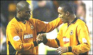 Wolves goalscorer George Ndah is congratulated by captain Paul Ince