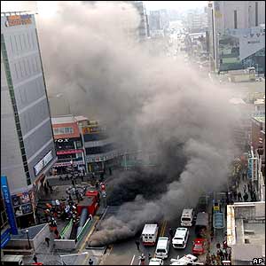 Smoke pours from a subway vent in Daegu, South Korea