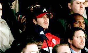 Manchester United's David Beckham watches his team from the stands against Leeds in February 2000