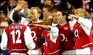 Arsenal players celebrate after Sylvain Wiltord's fourth minute goal
