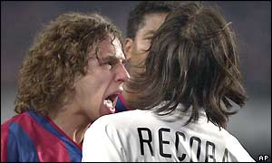 Barcelona's Carles Puyol and Inter's Alvaro Recoba exchange words before the Inter Milan player is sent off for a foul with just ten minutes of the match remaining