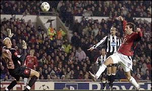 Ruud van Nistelrooy lifts the ball over the Juventus keeper to score Man Utd's second 