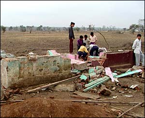 Villager in parts of Madhya Pradesh see what they can salvage from the floods that destroyed their homes