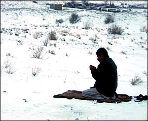 A man prays outside near to Quetta