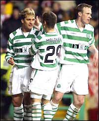 Stilian Petrov is congratulated by his team-mates after scoring Celtic's third goal