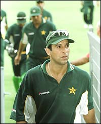 Wasim Akram leads his players off the pitch after a Carlton and United Breweries one-day game against Australia in Sydney in 2000