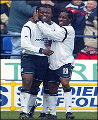 Bolton Wanderers goalscorer Bruno N'Gotty celebrates with Jay Jay Okacha 