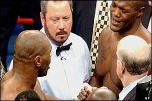 Clifford Eitenne congratulates Mike Tyson on his win