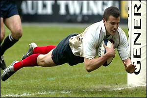 Damien Traille dives over the line for France's third try of the match