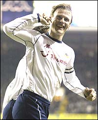 Teddy Sheringham salutes the Spurs fans after equalising against Fulham from the penalty spot