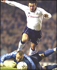 Maik Taylor brings down Spurs midfielder Simon Davies inside the penalty box and is then sent off