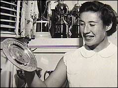 Little Mo holding one of her Wimbledon trophies courtesy of Maureen Connolly Brinker Tennis Foundation 