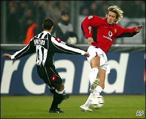 Juventus' Paolo Montero and David Beckham clash in the early stages of their crucial Group D clash