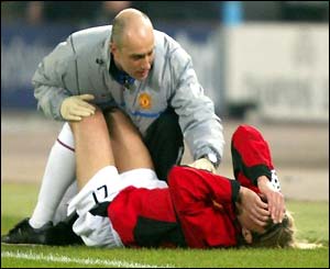 Manchester United's Diego Forlan receives treatment in the opening minutes