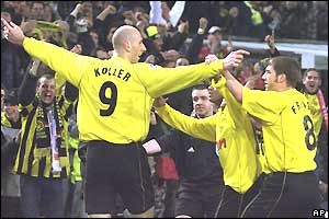 Jan Koller is mobbed after putting Borussia Dortmund ahead against Real Madrid