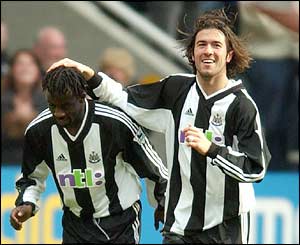 Newcastle United's Oliver Bernard celebrates his goal with Hugo Viana