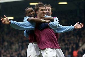 West Ham's Michael Carrick is congratulated by Jermain Defoe and Lee Bowyer after scoring his side's second goal