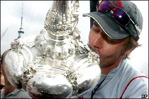 Ernesto Bertarelli plants a kiss on the America's Cup