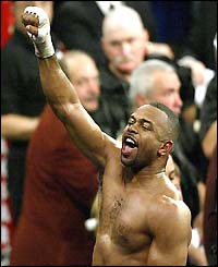 Roy Jones Jnr punches the air after his victory over John Ruiz