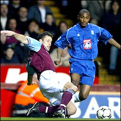 Former Man Utd defender Ronny Johnsen makes a sliding tackle for Villa to win possession from Birmingham's Clinton Morrison