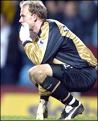 Aston Villa keeper Peter Enckelman crouches as he contemplates making another mistake in a Birmingham derby this season