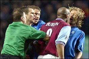 Aston Villa striker Dion Dublin headbutts Birmingham midfielder Robbie Savage