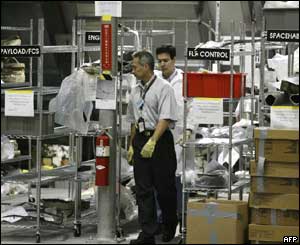 Technicians sort shuttle debris