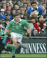 French scrum-half Dimitri Yachvili claims a high kick while O'Driscoll advances