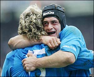 Micro Bergamasco is congratulated by Nicola Mazzucato after scoring Italy's only try of the game
