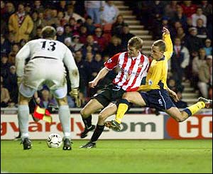 Tore-Andre Flo scores a rare goal for Sunderland against Spurs to give Sunderland their first win under Wilkinson