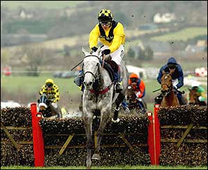 Rooster Booster pulls away in the final stages of the Champion Hurdle