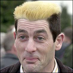 Irish racing fan John Dodd from Dublin sports a 'Guinness' haircut 