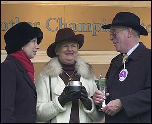 The Princess Royal presents the trophy for the Queen Mothers Champion Chase Moscow Flyer's owners, Brian and Patricia Kearney