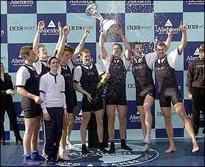 Oxford president Ben Burch holds the 2002 trophy with the rest of the crew 