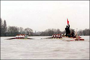 Umpire Rupert Obholzer stops the 2001 race after rower Colin Swainson loses his oar