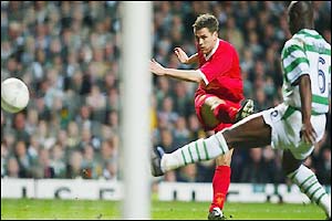 Owen slices his shot at goal wide, missing the opportunity to win the game for the Reds