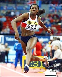 Ashia Hansen competes in the women's triple-jump