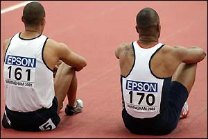 Jason Gardener and Mark Lewis-Francis sit dejected after the 60m final