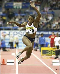 Ashia Hansen competes in the final of the women's triple jump
