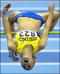 Sweden's Kajsa Bergqvist bends over the bar during the women's high jump final