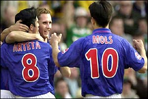 Rangers winger Peter Lovenkrands is congratulated on his goal