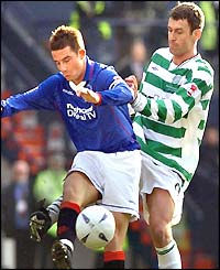 Rangers' Barry Ferguson gets to the ball ahead of Celtic's Chris Sutton