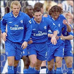 Chelsea players congratulate goalscorer Mario Stanic (right)